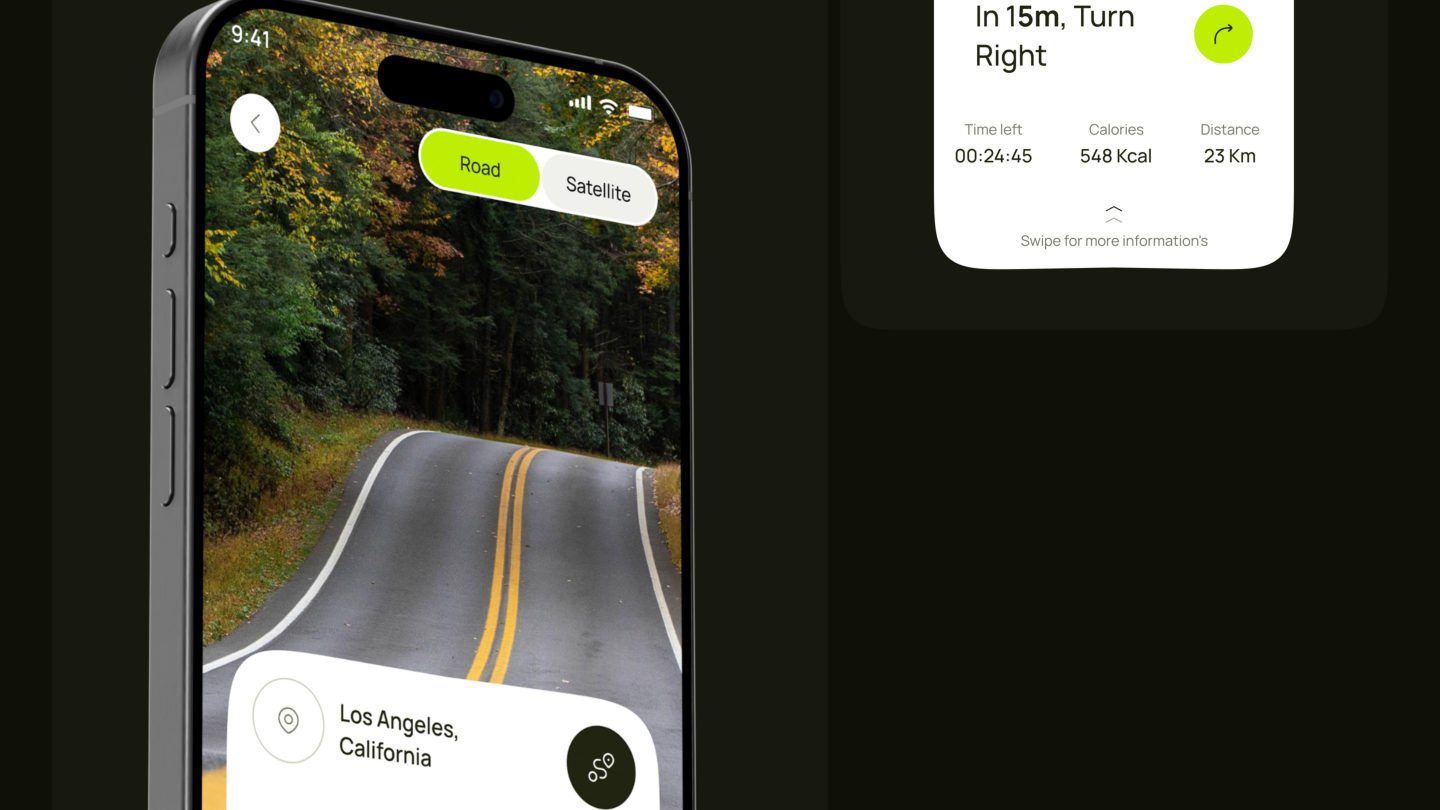 Cycling navigation app on a phone showing a forest road with turn directions